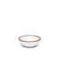 A small shallow ceramic bowl in a cool white color featuring iron speckles and an unglazed rim