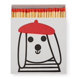 Dog by Jane Foster| Square - Safety MatchesJane Foster's charming line illustration of her beret-wearing pup brings whimsy and charm to the humble matchbox.