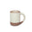A medium sized ceramic mug with handle in a warm, tan-toned, off-white color featuring iron speckles and unglazed rim and bottom base.