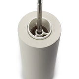 Inside view of white salt grinder with metal core on a white background