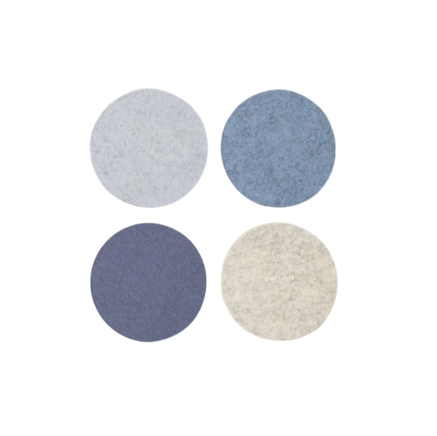 Four round felt coasters in gray, blue, and beige on a white background