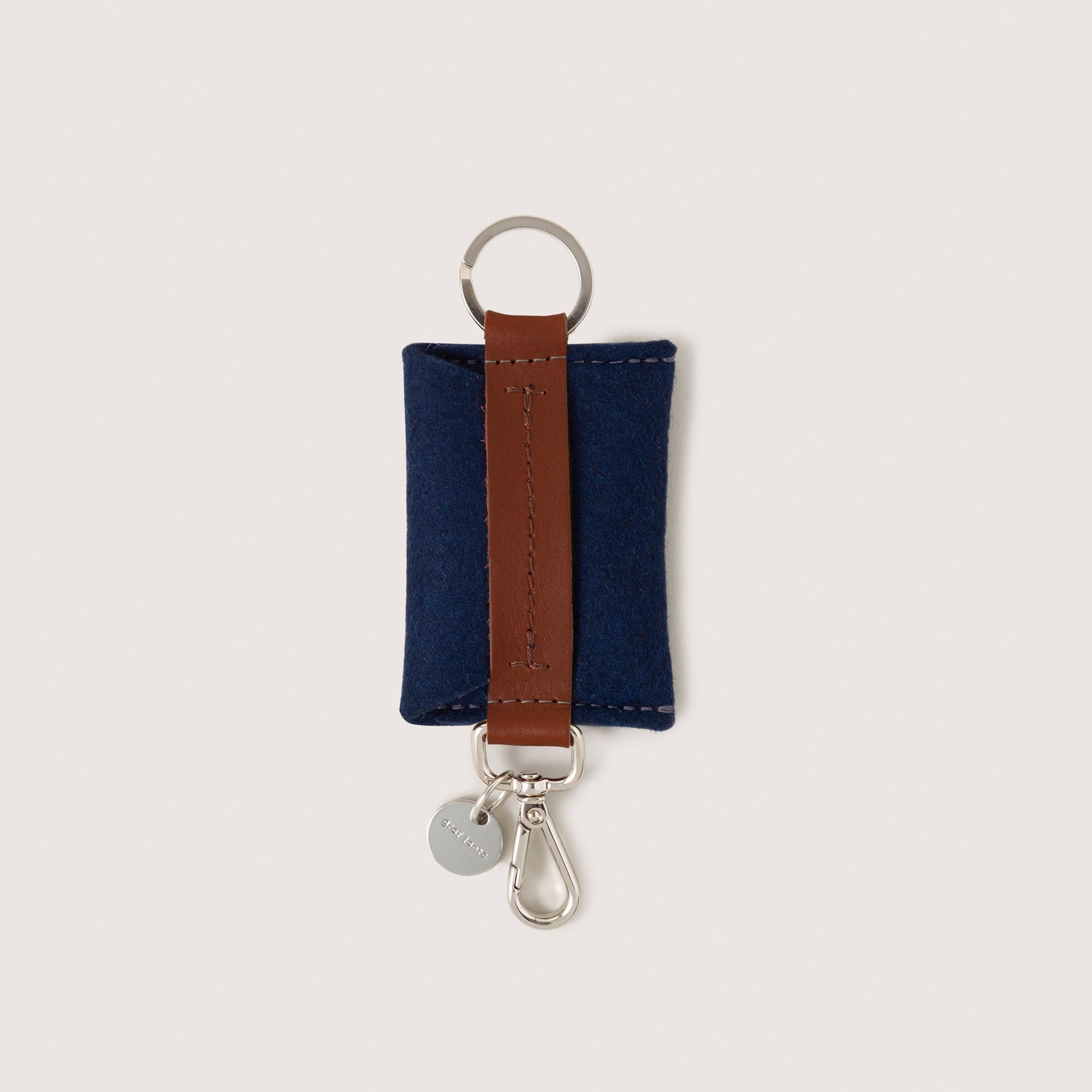 Marine Merino Wool Card Key Fob with silver colored Lobster Clasp, Flat Wide Keyring, and Logo Tog Tag, white background.