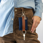 Blue Merino Wool Card Key Fob on woman's belt loop of brown pants, front view.