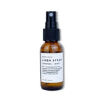 Linen spray bottle with label on a white background