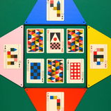 Playing cards with colorful geometric patterns on a green background