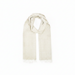 A light beige woven scarf with fringed edges, draped in a looped style against a plain white background.