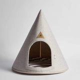 Teepee-shaped pet bed with a triangular logo on a light gray background