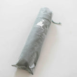 Gray pet product packaging with a brand logo on a white background