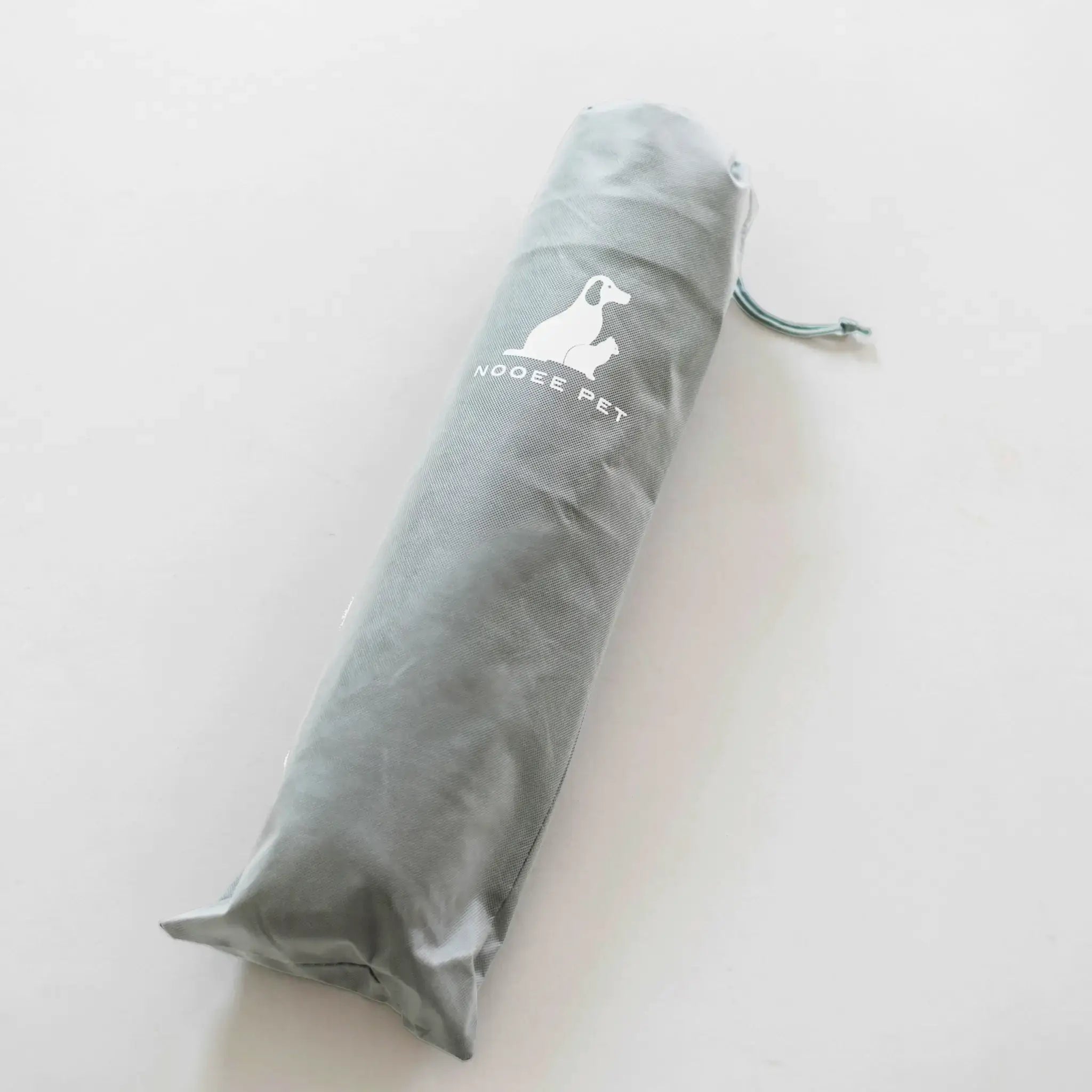 Gray pet product packaging with a brand logo on a white background