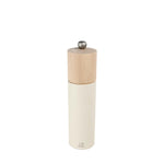 White salt grinder with wooden top on a white background