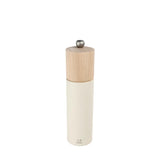 White salt grinder with wooden top on a white background