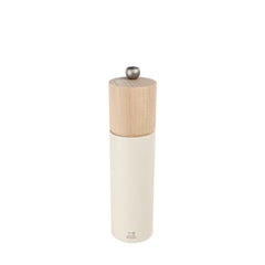 White salt grinder with wooden top on a white background