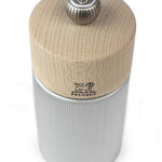 Top view of Peugeot salt mill with wooden top and striated metal body.