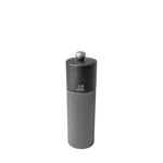 Gray pepper grinder with grey wooden top and metal body with Peugeot logo