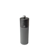 Gray pepper grinder with grey wooden top and metal body with Peugeot logo