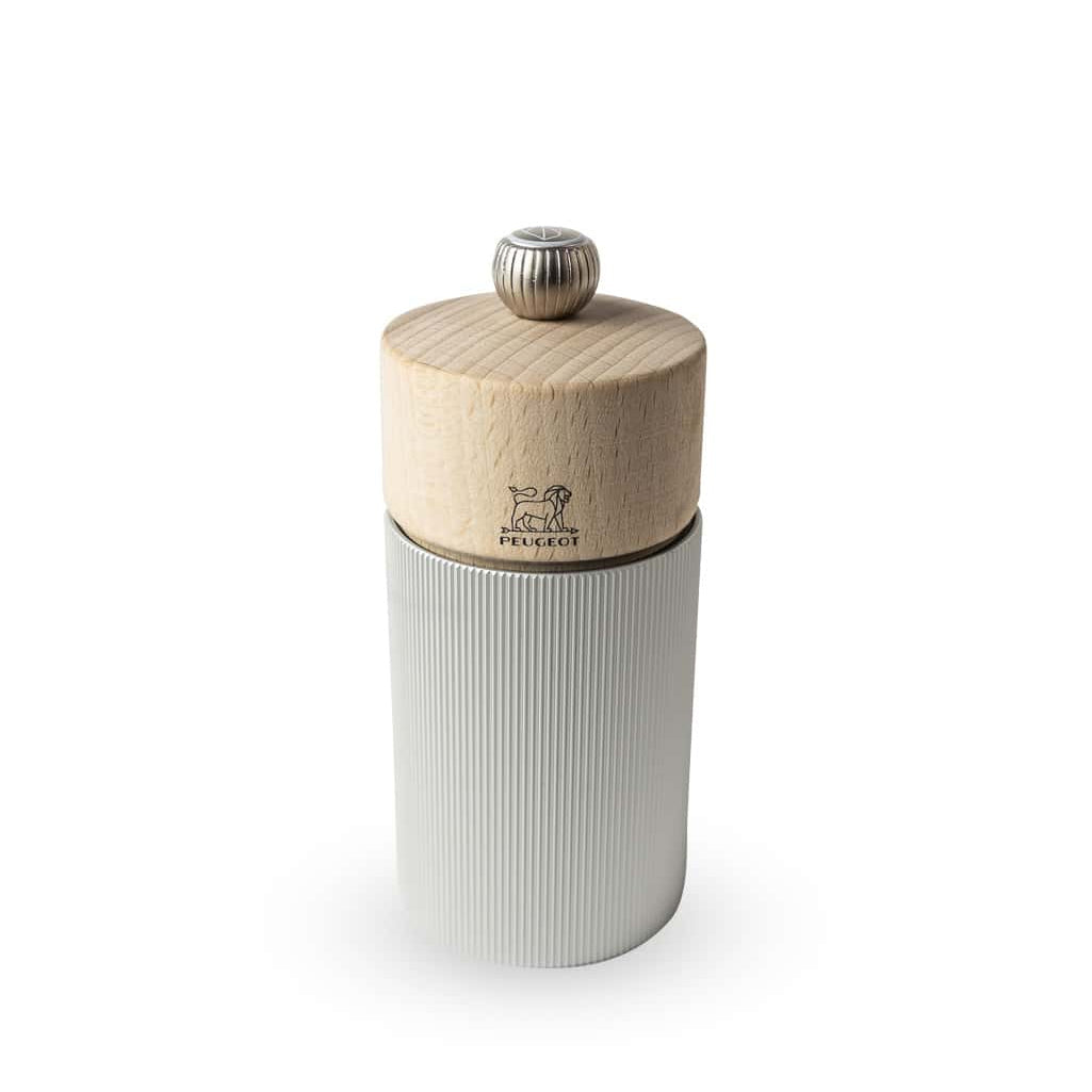 Peugeot Line salt mill featuring a metal body with a natural wood top, standing upright against a white background.