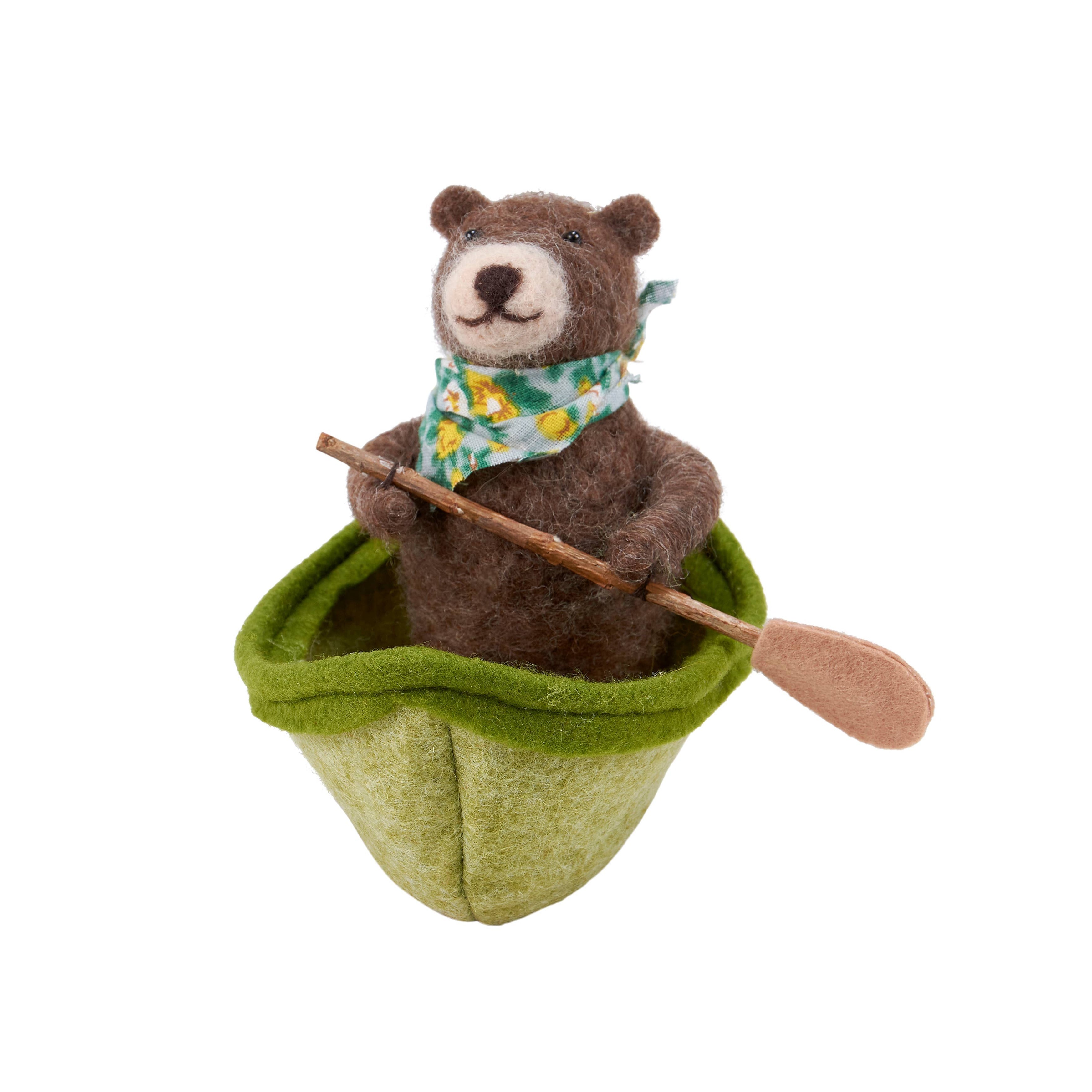 felt bear in a green kayak with a paddle 