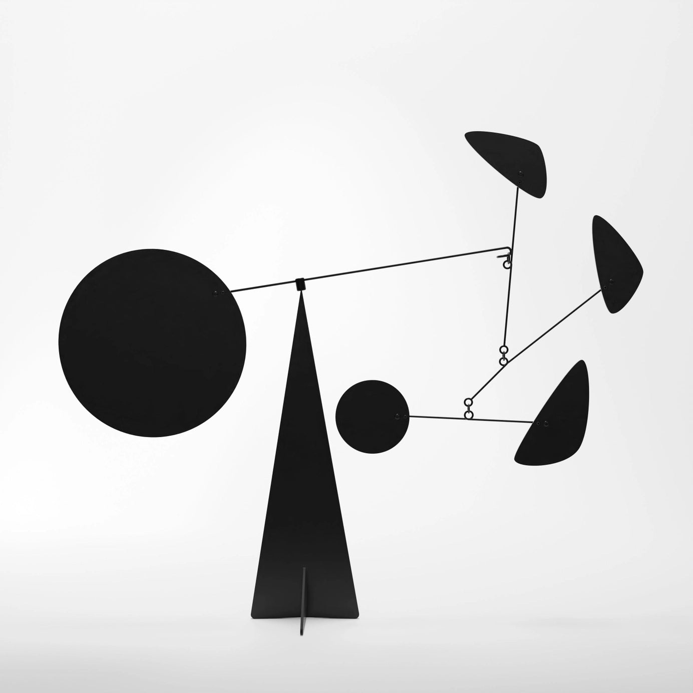 Black abstract sculpture on a white background
