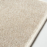 closeup of portion of beige sasawashi bath mat surface with small loops