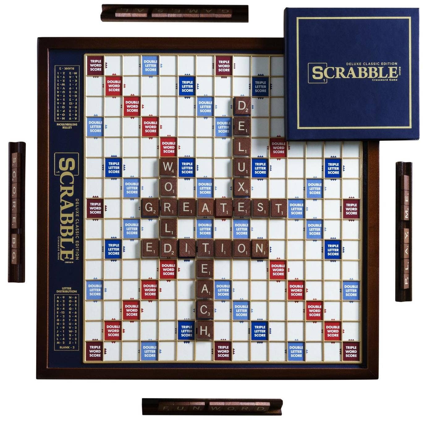 Scrabble board game with tiles and packaging on a white background
