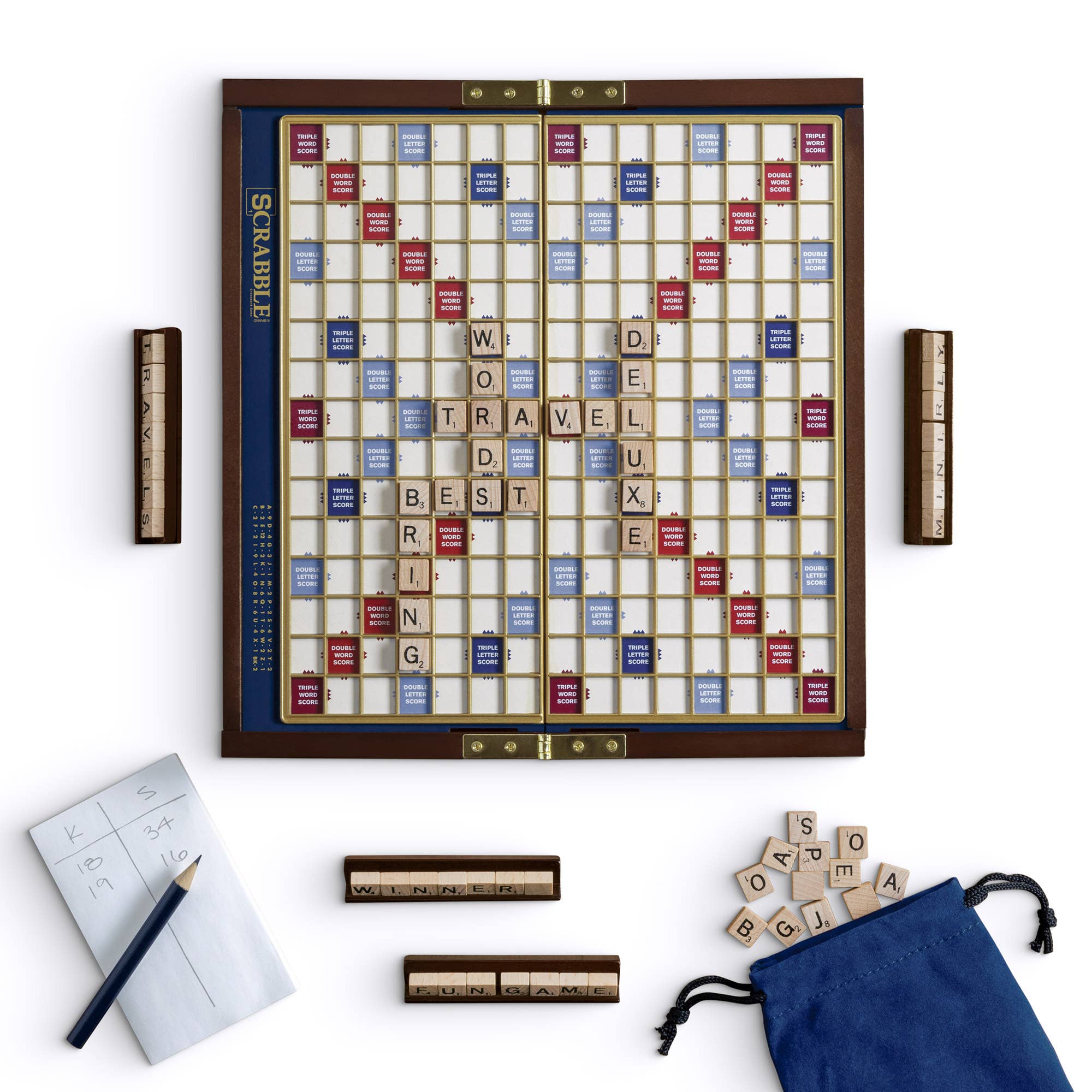 Scrabble board game with tiles and accessories on a white background