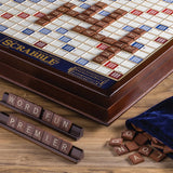 Scrabble board game with tiles and bag on a wooden surface