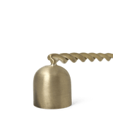 close up detail of head of brass snuffer with a twisted handle 