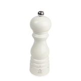 White glossy salt mill with silver top on a white background