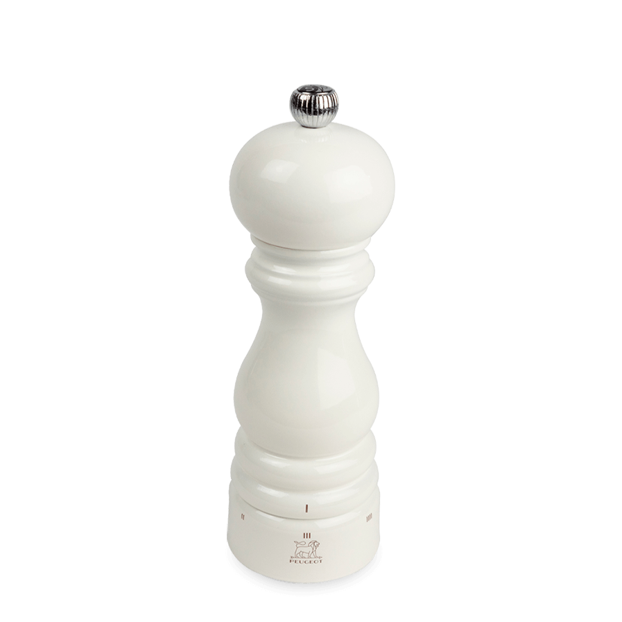 White glossy salt mill with silver top on a white background