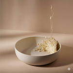 White bowl with enoki mushrooms on a beige background