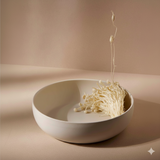 White bowl with enoki mushrooms on a beige background