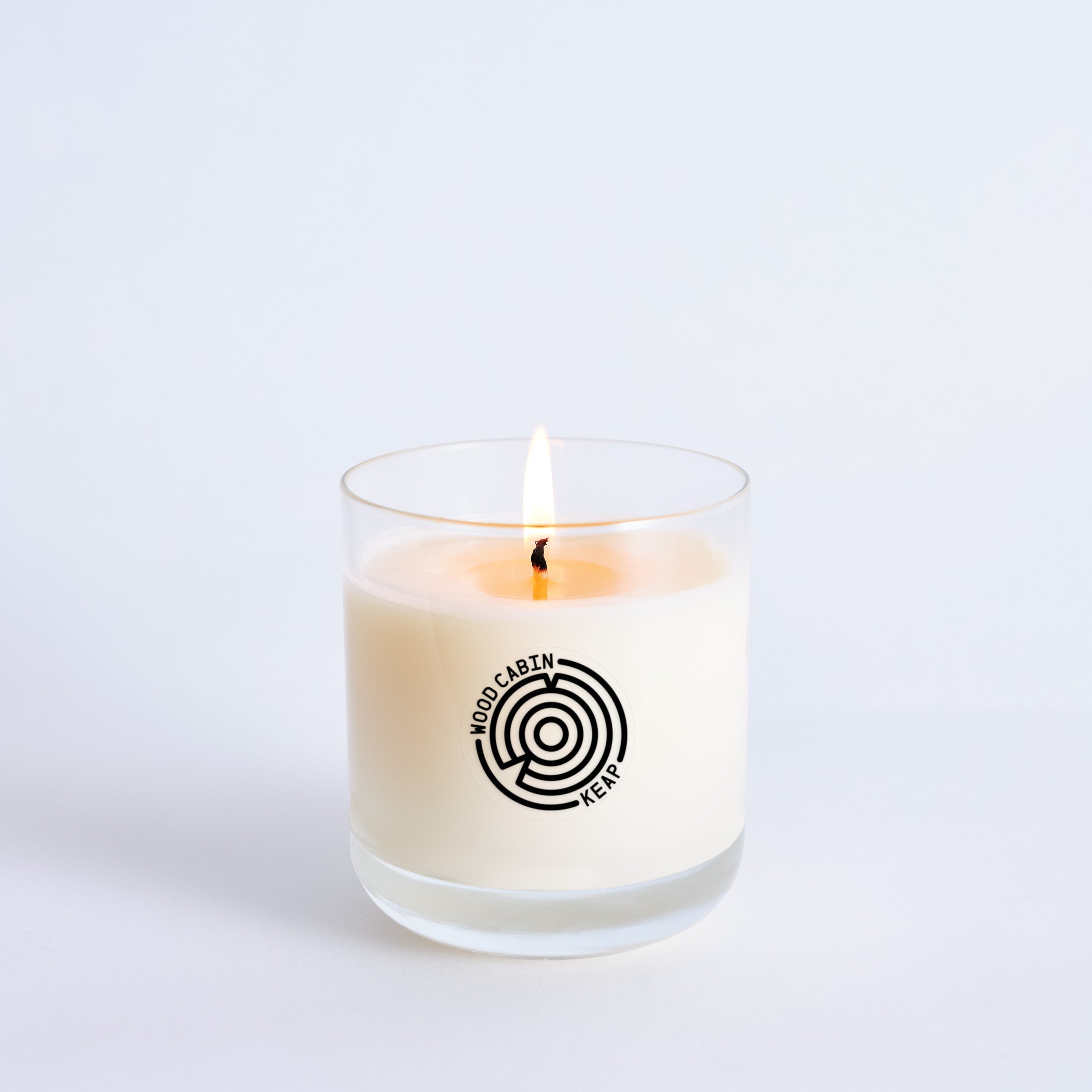 Candle in a glass jar with a logo on a white background