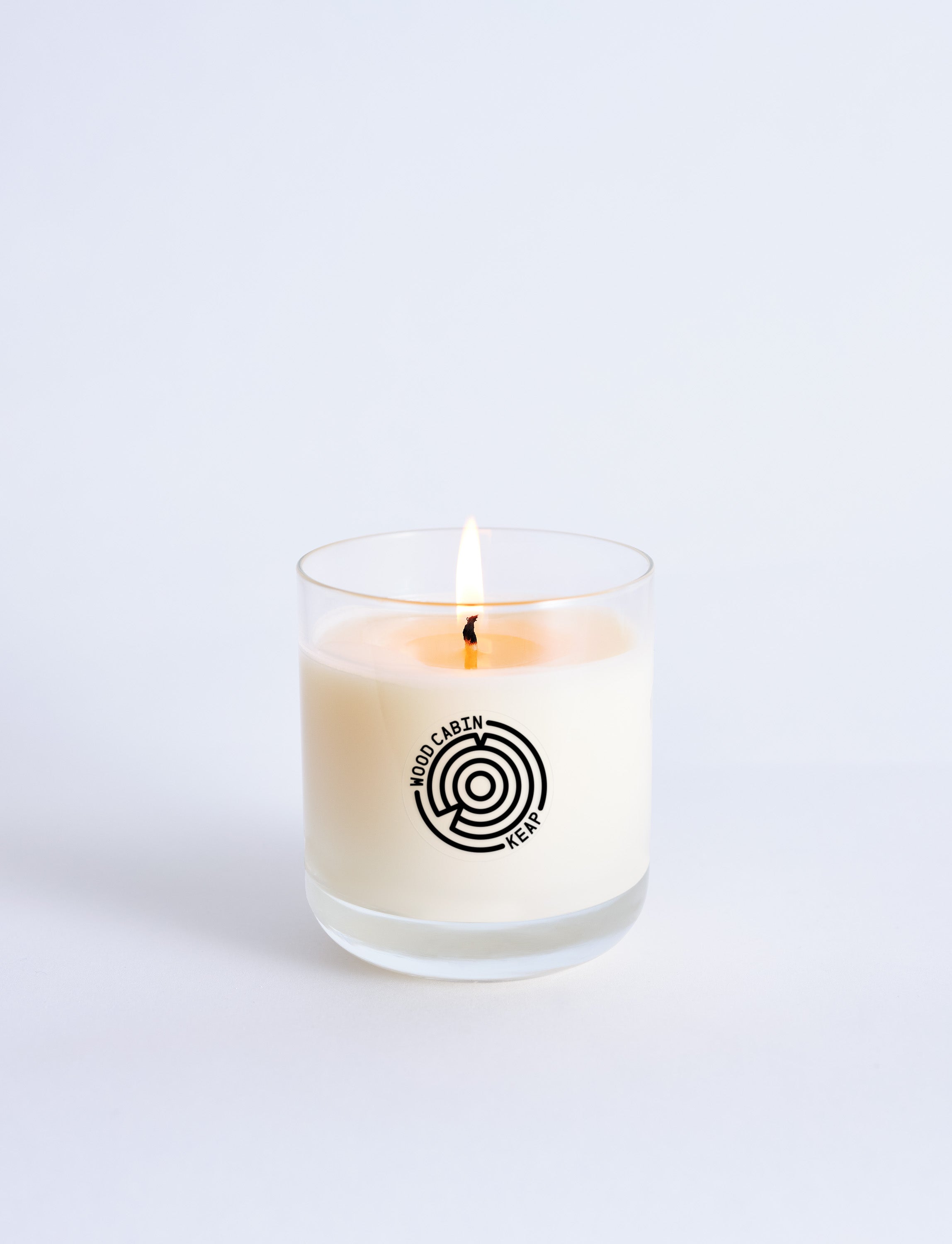 Candle in a glass jar with a logo on a white background