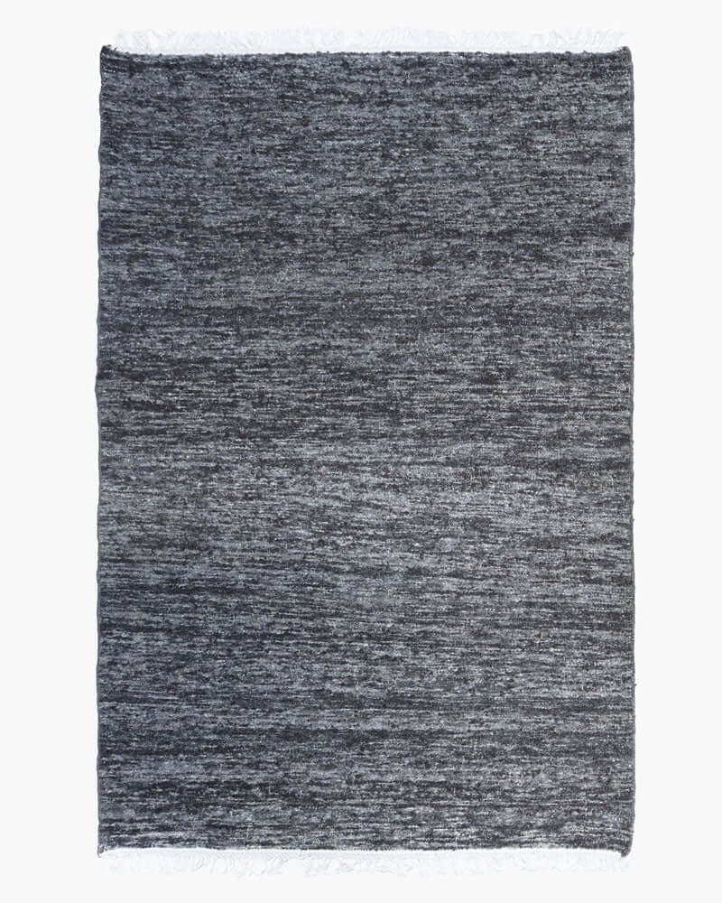 mark krebs charcoal rug against white background