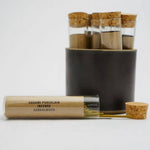 Set of glass test tubes with cork lids on a white background