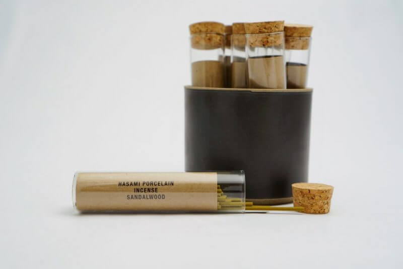 Set of glass test tubes with cork lids on a white background