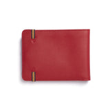 Back view of red leather rectangular wallet, with light brown and black elastic ends stitched onto wallet.