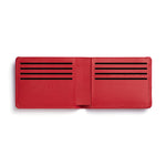 Red rectangular leather wallet unfolded with 8 card slots.