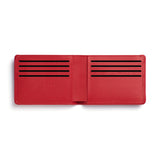Red rectangular leather wallet unfolded with 8 card slots.